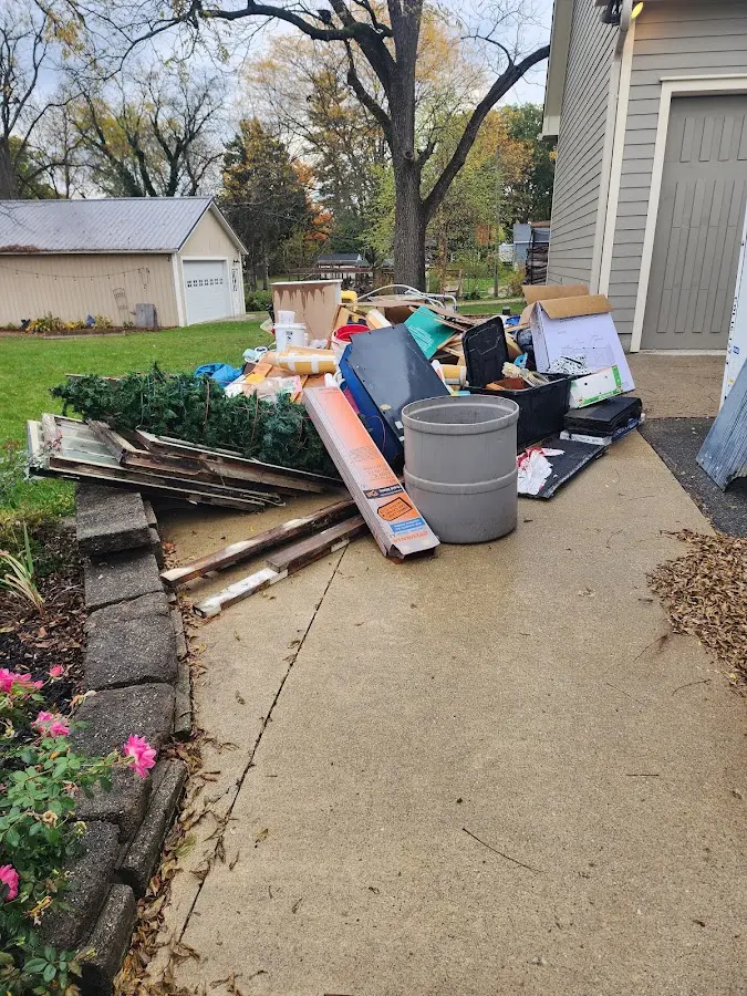 Dumpster being loaded with debris for Estate Cleanout Dumpster Rental in Laguna Niguel